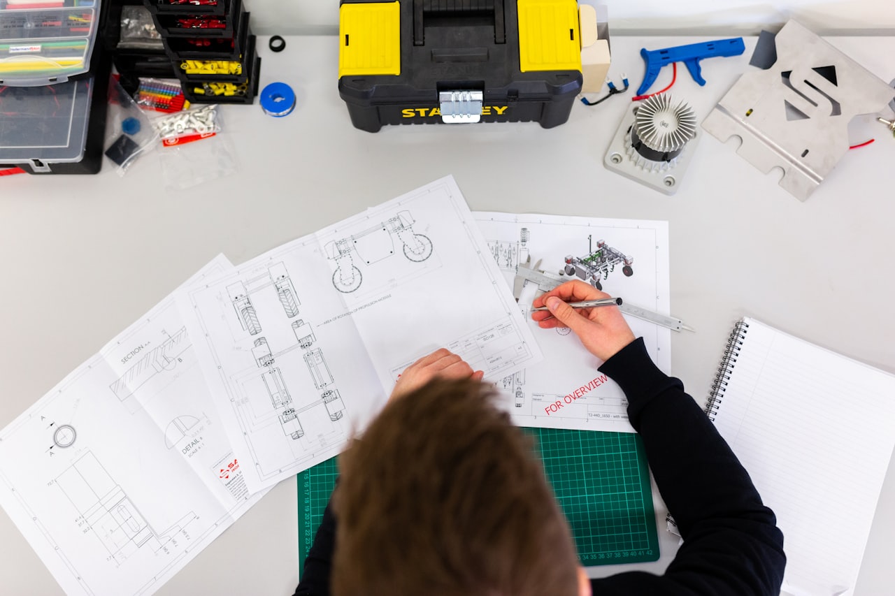 Engineer working from technical drawings and specifications