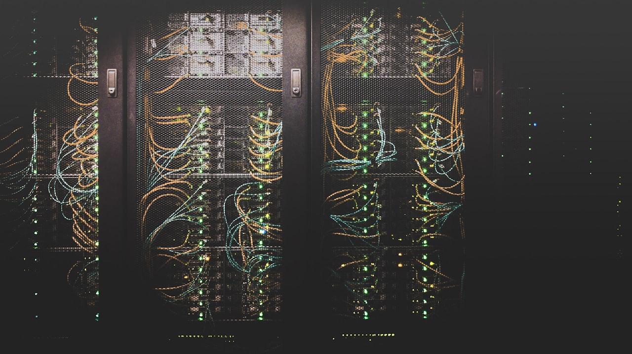 Rows of server racks with patch cabling in a data center